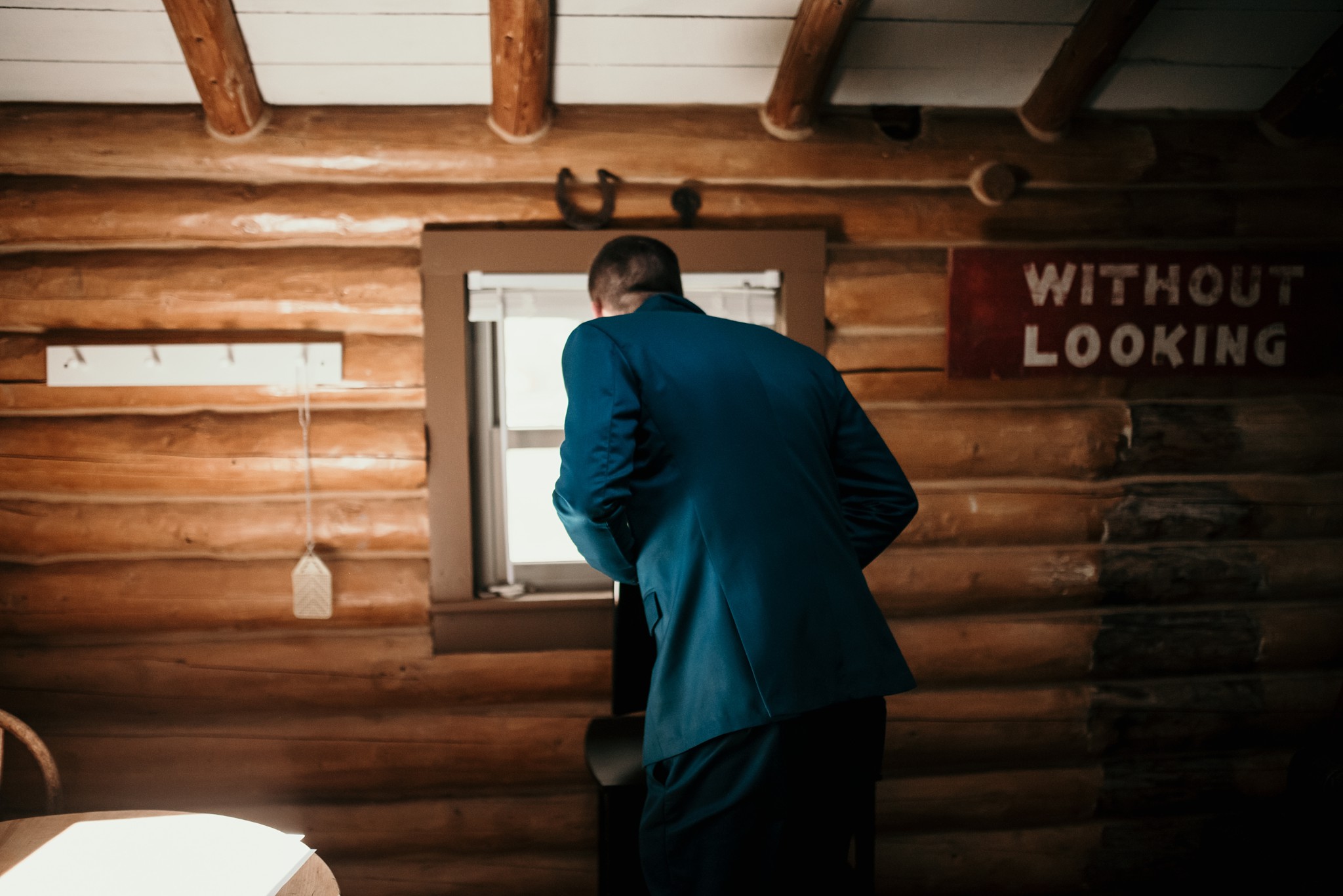 Groom-to-be looking out the cabin window.