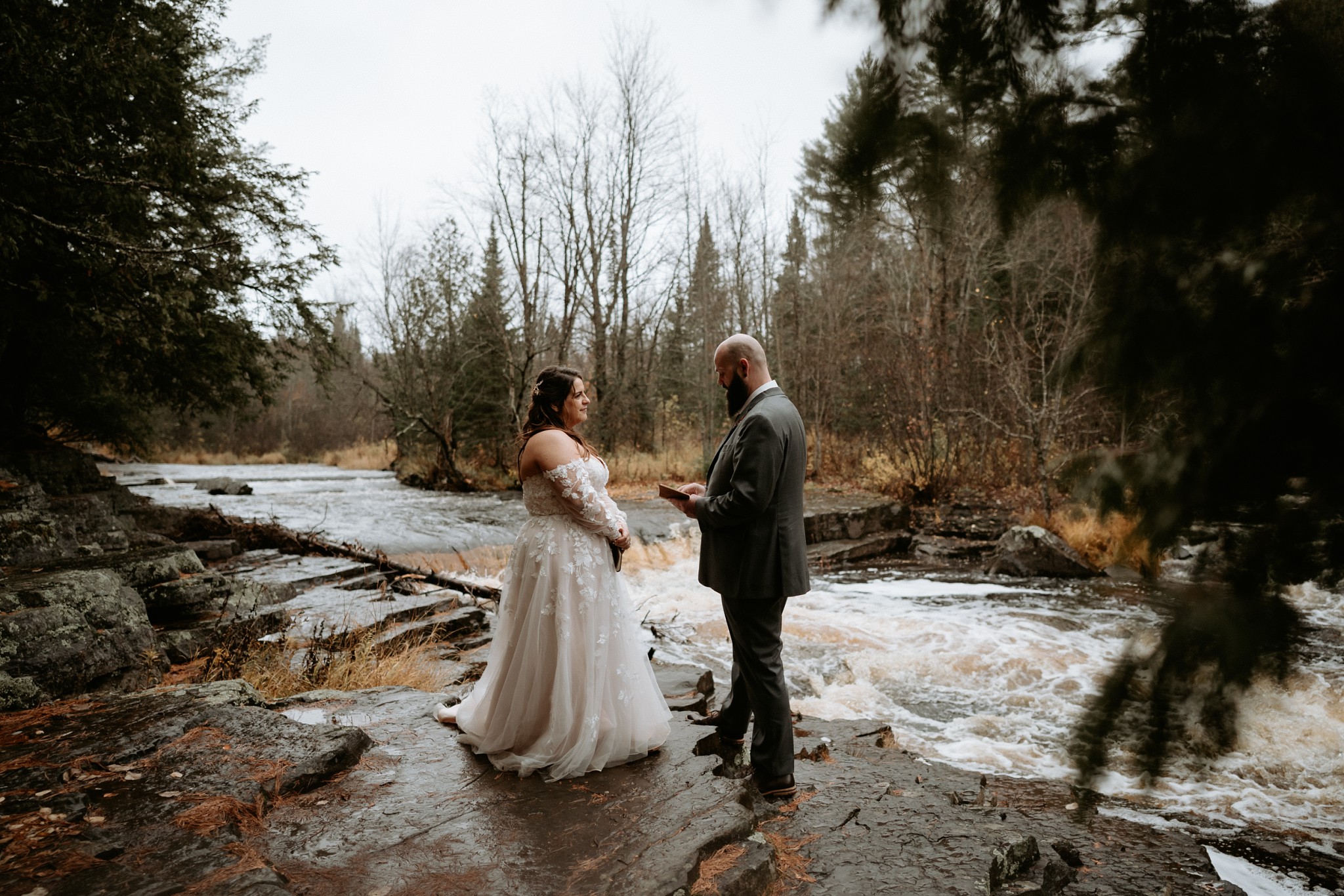 A groom reading his vows during an elopement at Canyon Falls.